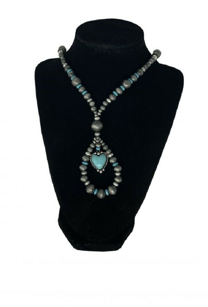 Turquoise beaded necklace with heart charm. Measures Approx 21" Long